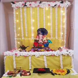 Yellow & white flower backdrop + Ganpati setup